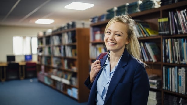 Smiling girl in library