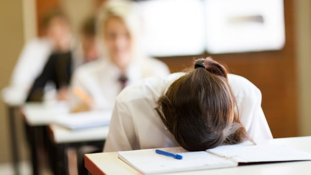 Sleeping girl in exam