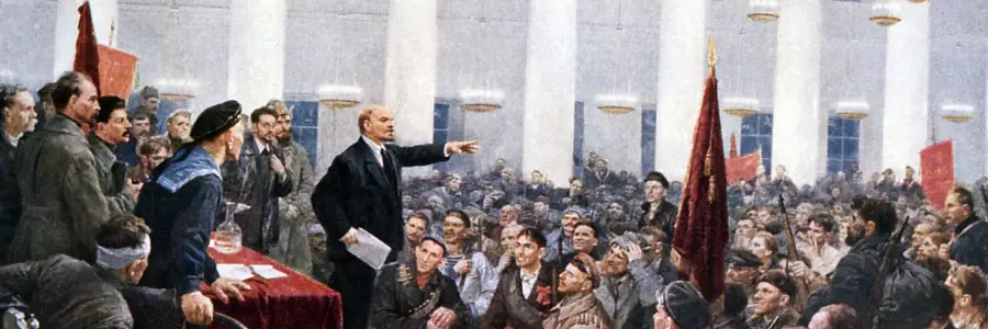 Lenin delivering a speech during the Russian Revolution to a crowd of supporters.